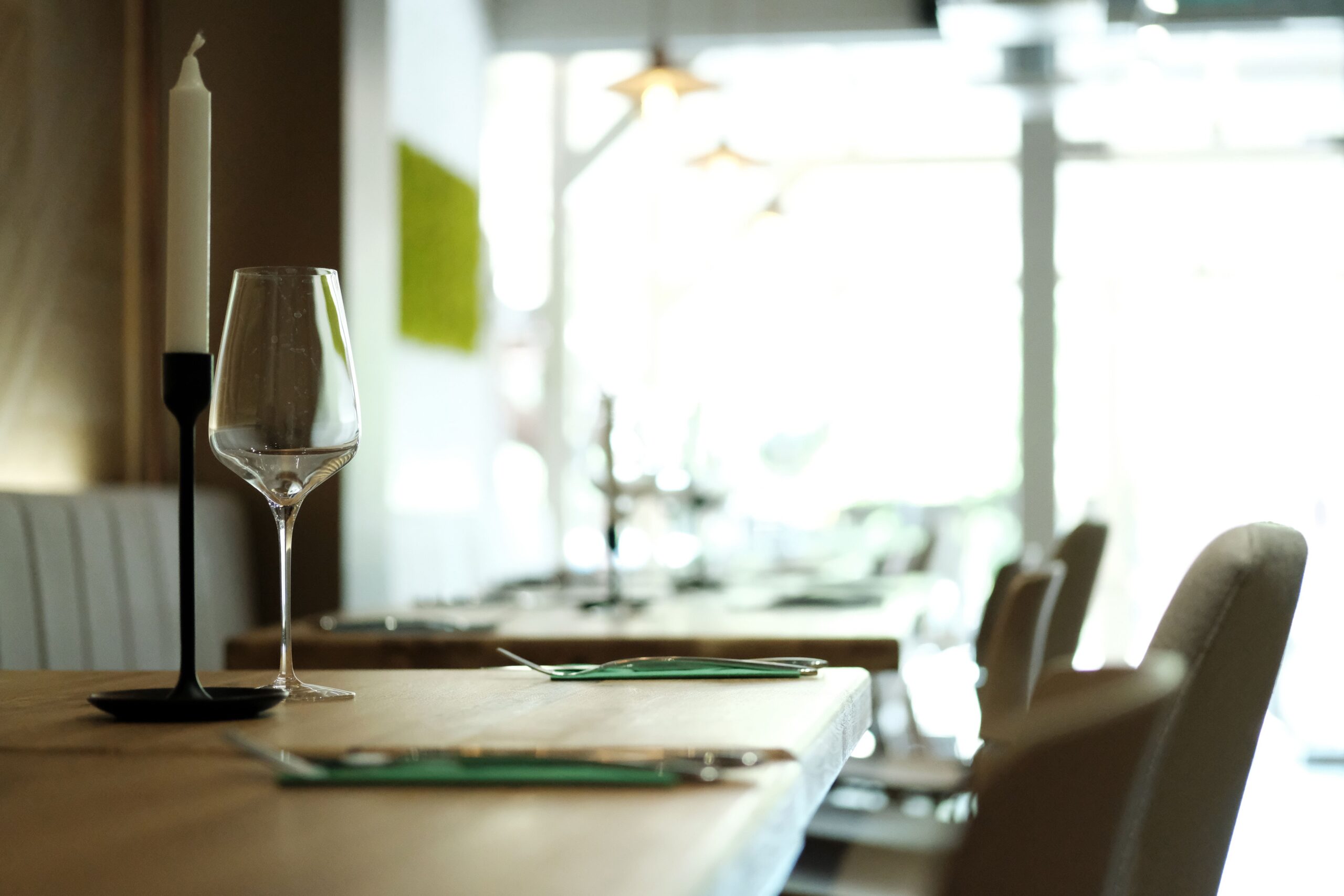 Table setting with wine glasses at the modern restaurant.